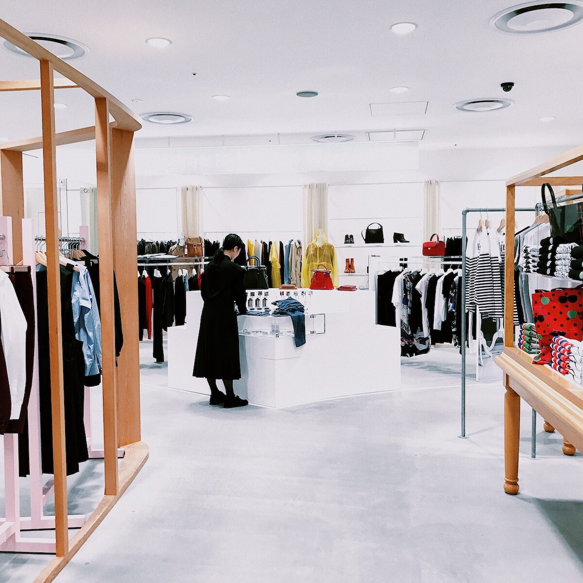 woman standing inside clothing area